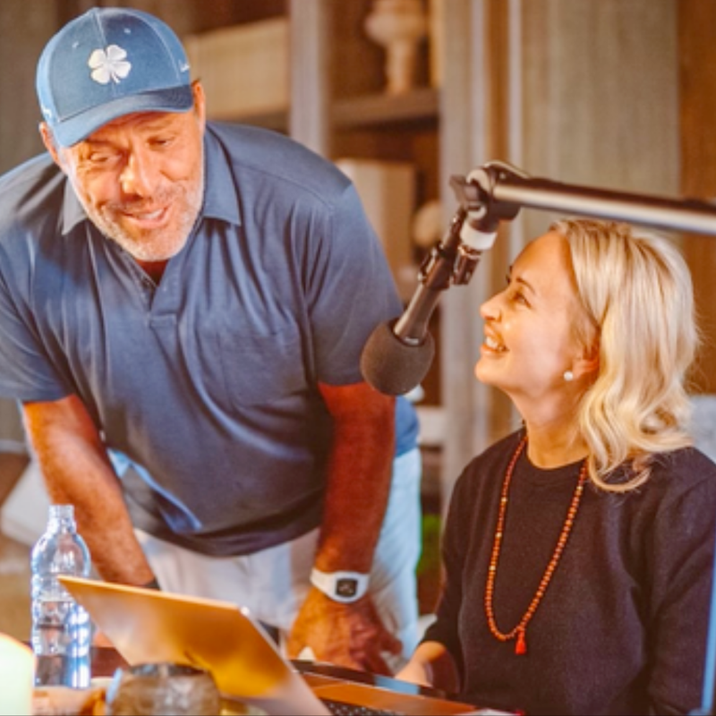 The power of love image of Tony & Sage Robbins in front of laptop and microphone