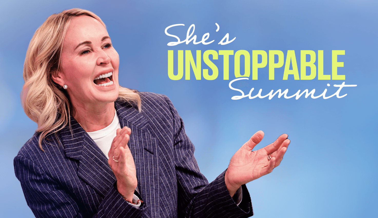 a woman stands in front of a sign that says she 's unstoppable summit