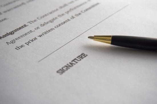 a pen is sitting on top of a piece of paper .