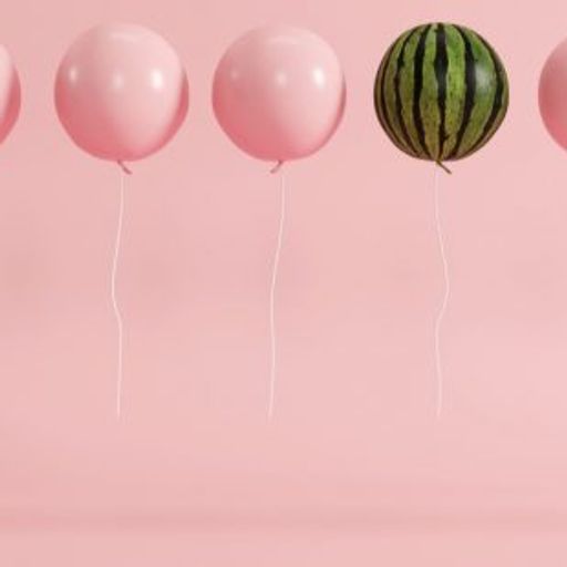 a watermelon is floating in the air next to a row of pink balloons .