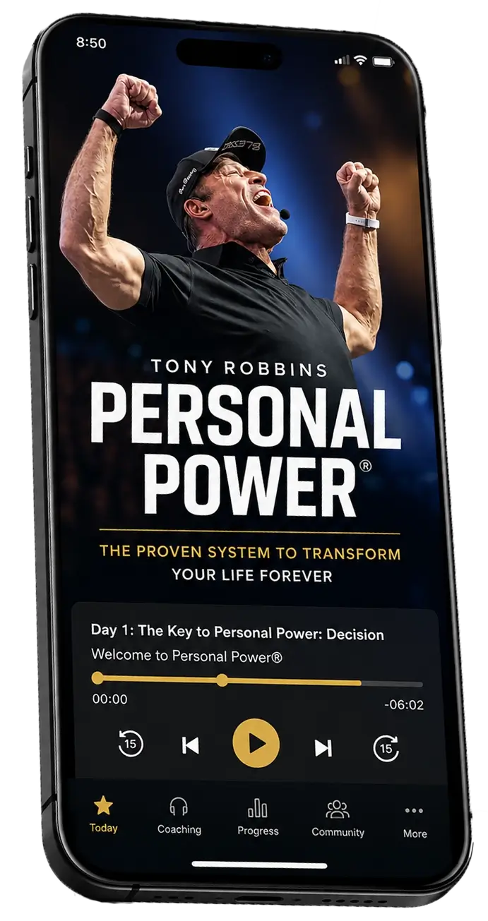 An iPhone displaying the Tony Robbins "Personal Power" app, showing an energetic Tony Robbins with raised arms and an audio player interface.