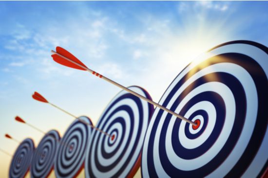 an arrow is hitting the center of a target .