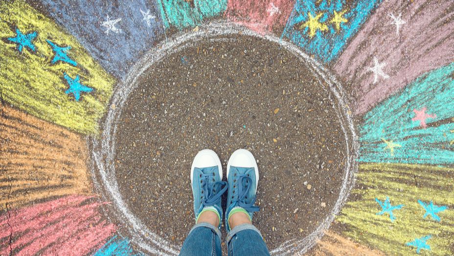 a person is standing in a circle drawn on the ground with chalk .