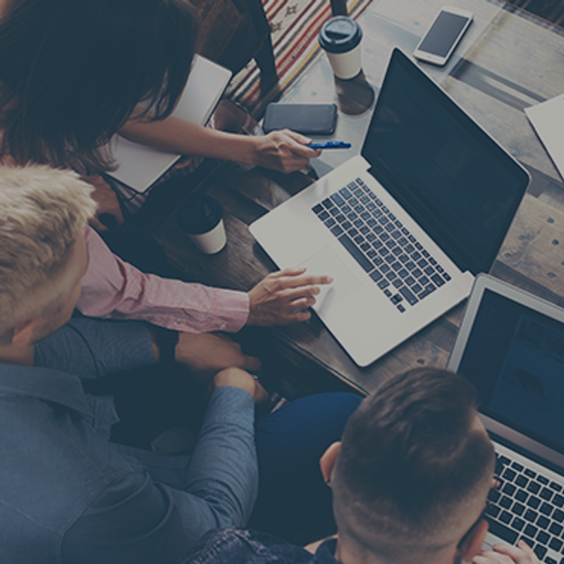 The future of crowdfunding image of people working on laptops