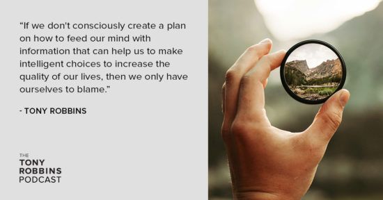 person holding a magnifying glass in their hand with a quote from Tony Robbins .