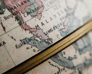 a close up of a globe with a map of malaysia on it .