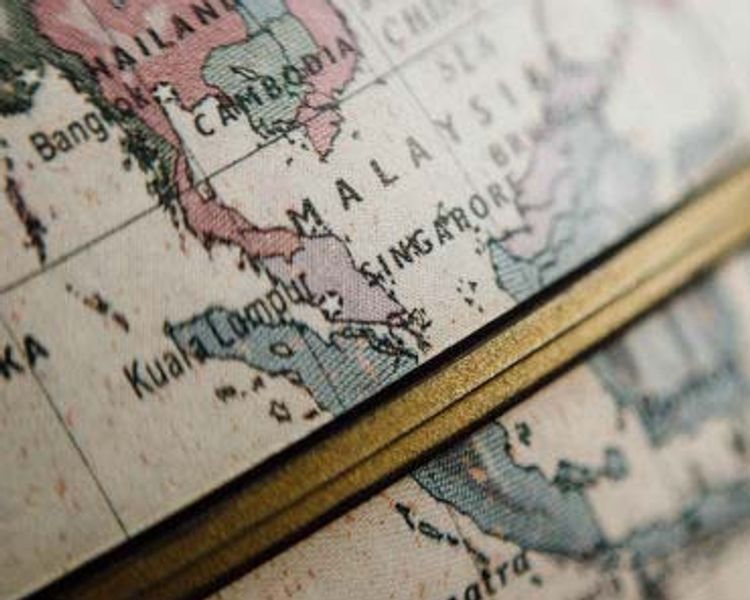 a close up of a globe with a map of malaysia on it .