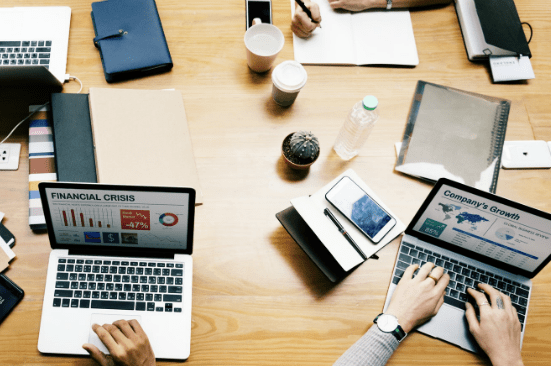 a laptop with financial crisis on the screen