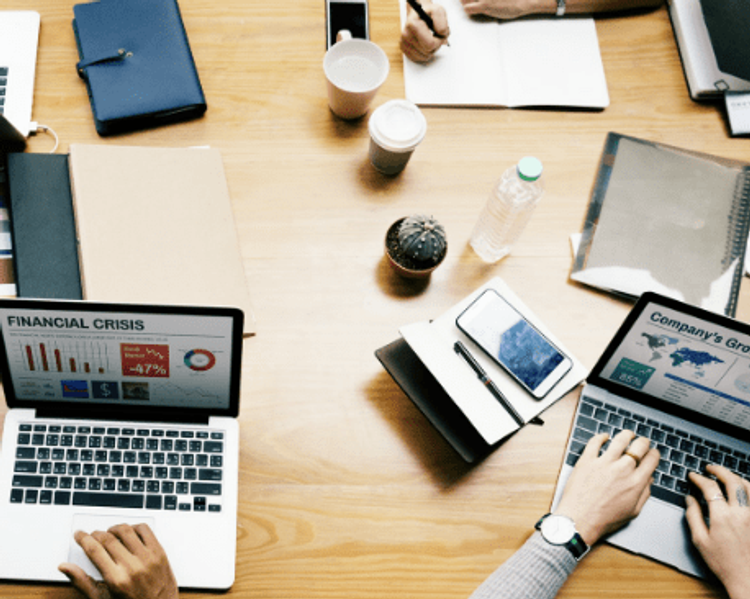 a laptop with financial crisis on the screen