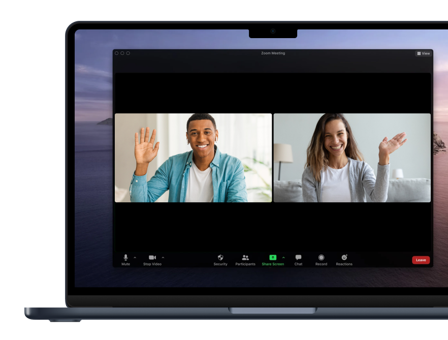 a laptop screen shows a man and a woman on a zoom meeting