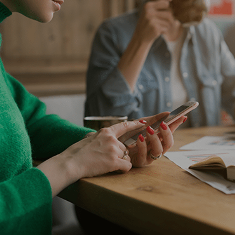 Obsessions, Addictions and Compulsions image of woman looking at phone