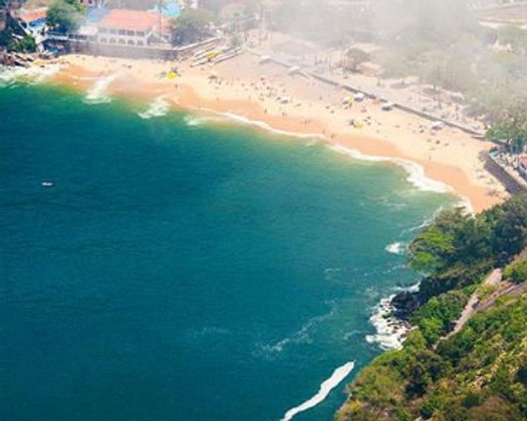 a close up of a 5 euro bill with a building in the background .