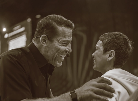 a man and a woman are smiling at each other