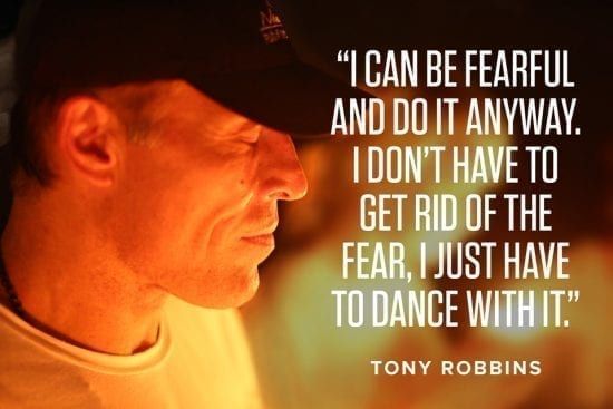 a man is wearing a hat and a quote from tony robbins