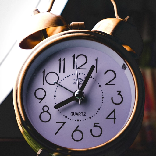 a man is tying his shoes on the sidewalk .
