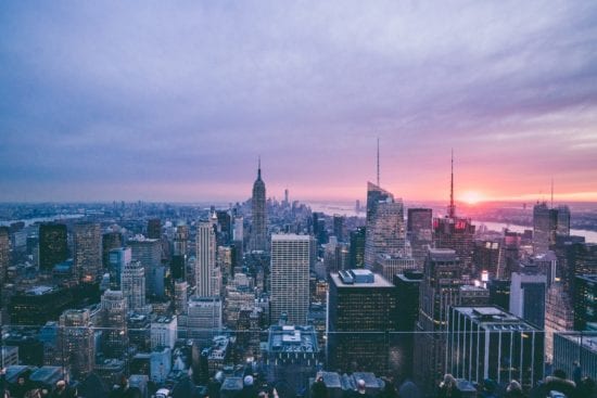 an aerial view of a city skyline at sunset .