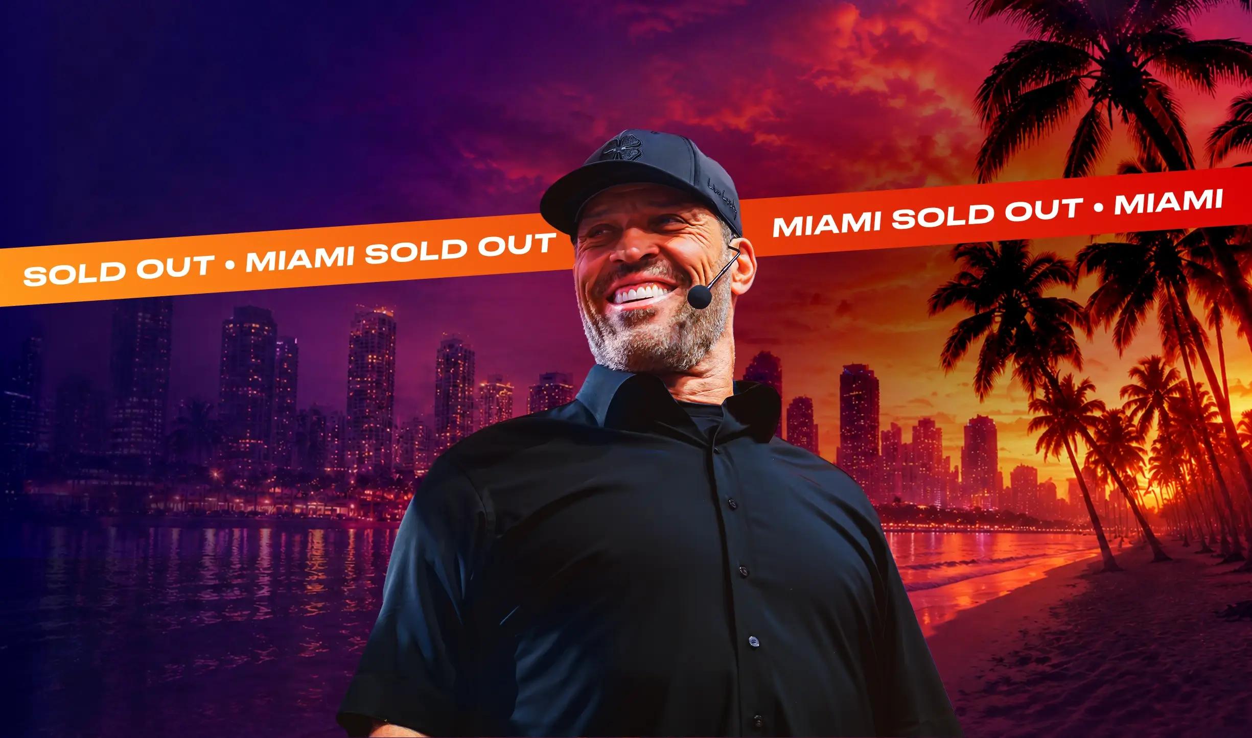 Tony Robbins smiles in a cap and microphone against a split background of a night city skyline and a sunset beach, with a "SOLD OUT • MIAMI SOLD OUT" banner.