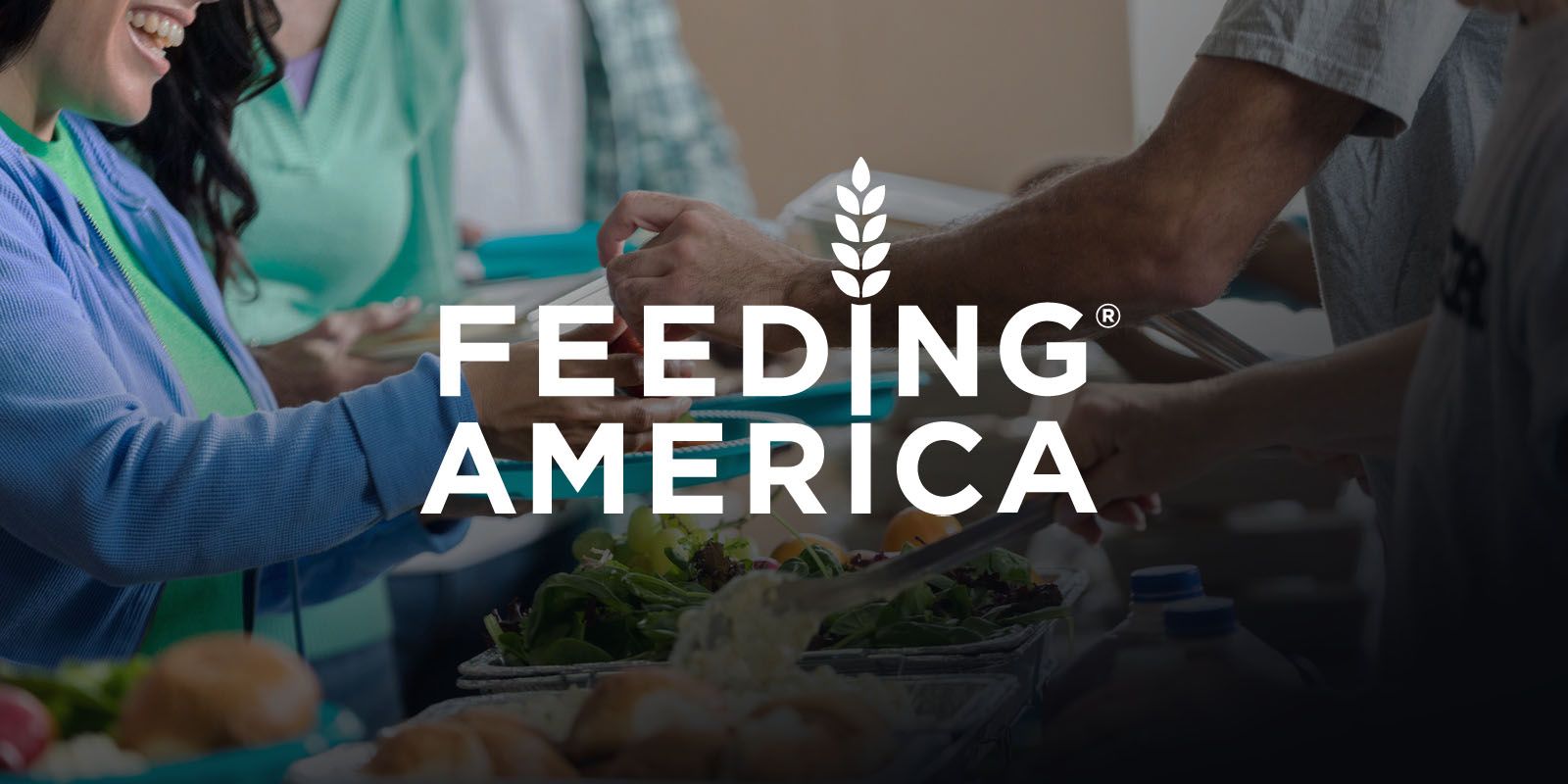 Feeding America logo over an image of people serving food.