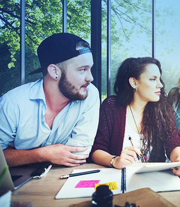 The personality dynamics of winning teams image of man & woman at a table in a meeting