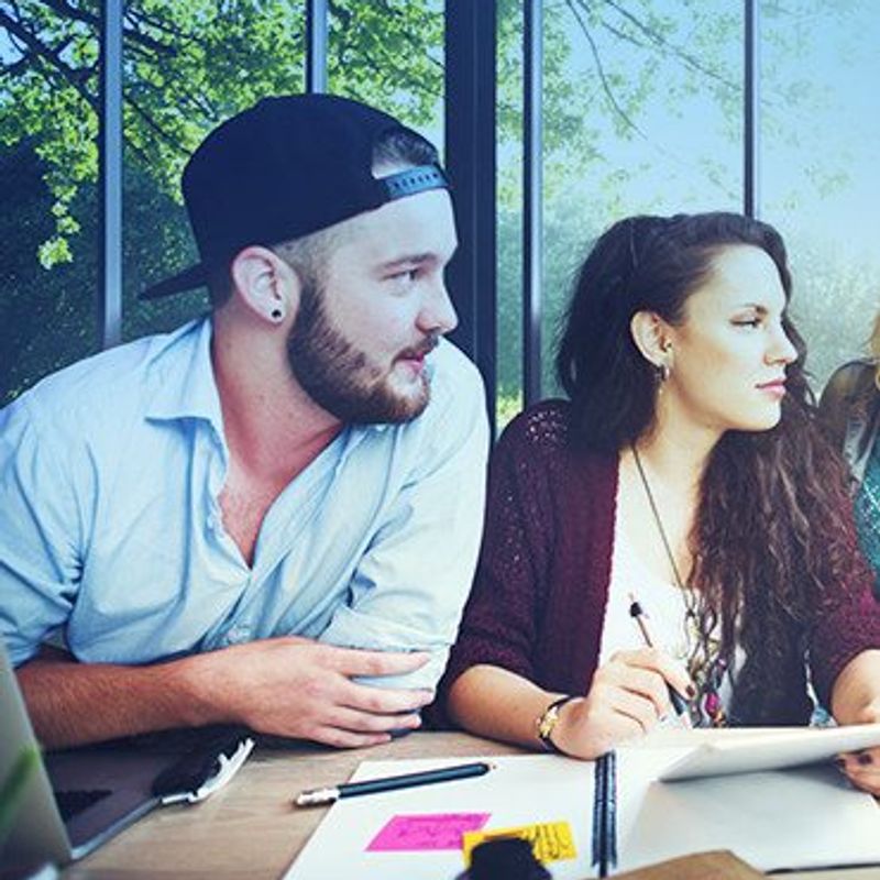 The personality dynamics of winning teams image of man & woman at a table in a meeting