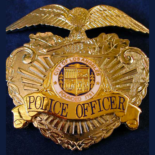 a gold badge for a police officer from the city of los angeles