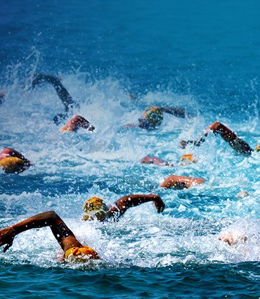 How to make competition irrelevant image of people swimming in an ocean race