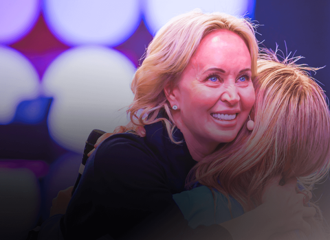 Sage Robbins two women are hugging each other and one is smiling