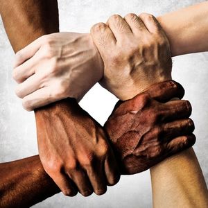 Continuing the Conversation for Healing and Unity image of a diverse group of people are putting their hands together