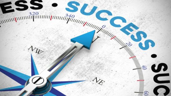 a compass with a blue arrow pointing to the word success .