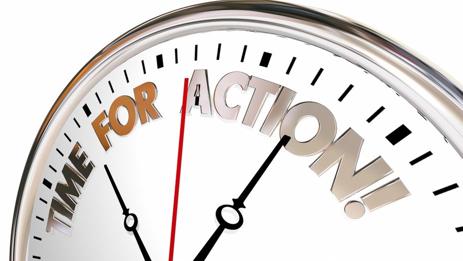 a clock with the words `` time for action '' written on it .