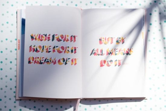 a book is open to a page with a quote on it .