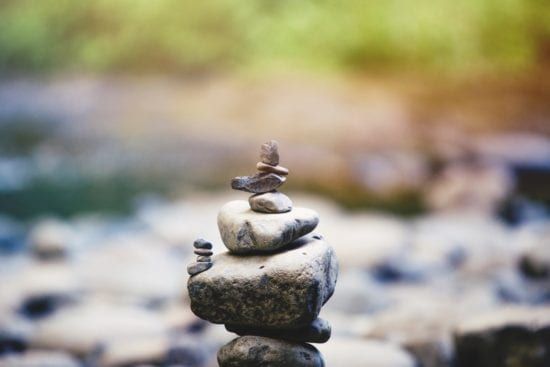 a pile of rocks stacked on top of each other on a rocky surface .