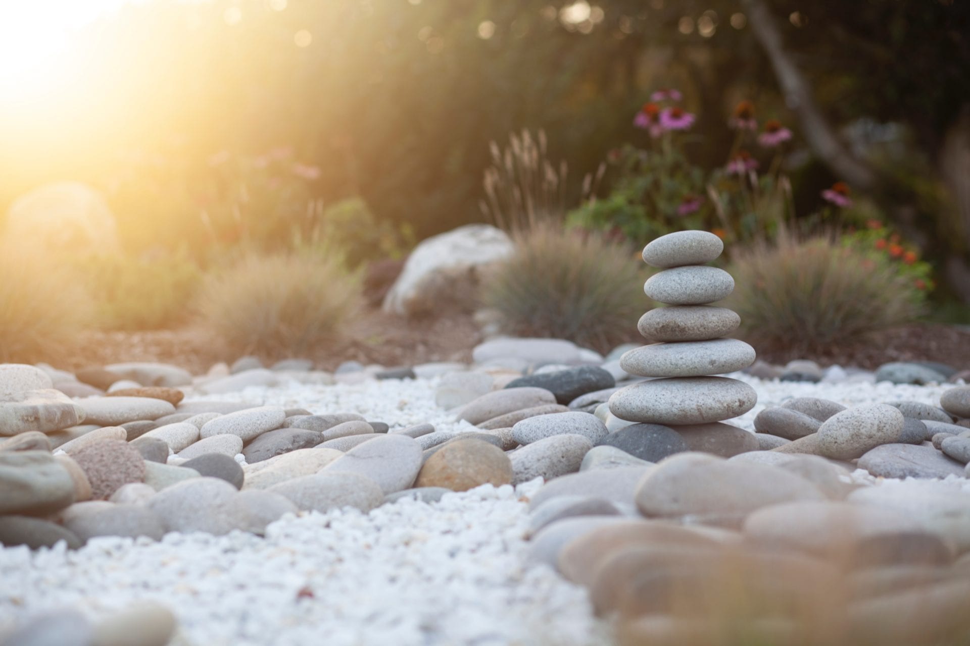 a pile of rocks stacked on top of each other in a garden .