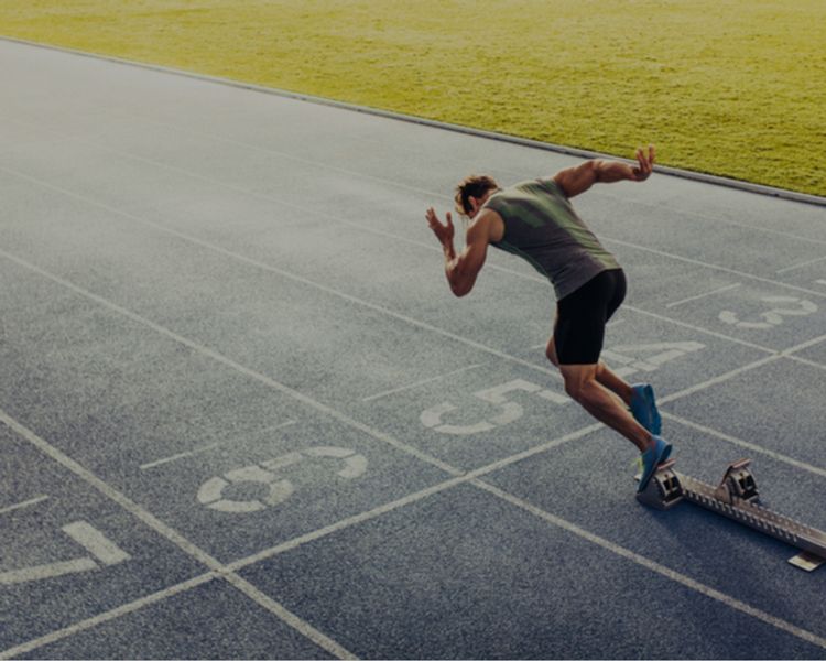 a man is getting ready to run on a track .