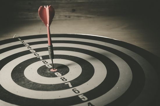 a dart is in the center of a dart board .