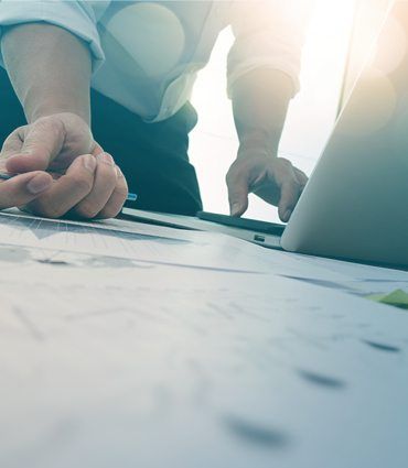 The power of habits Image of hands on a laptop and desk