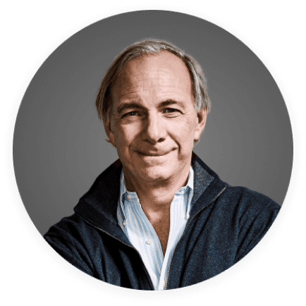 a man wearing a blue jacket and striped shirt smiles for the camera