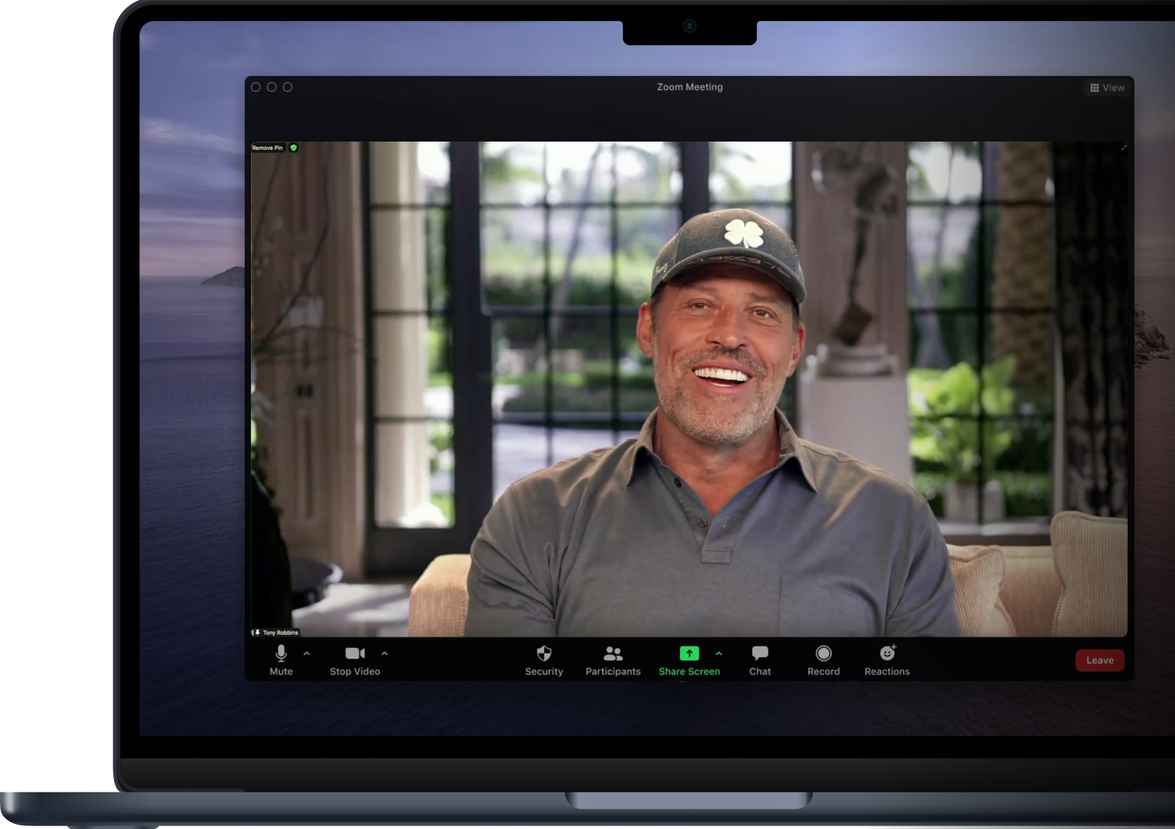 a man wearing a clover hat is on a zoom meeting