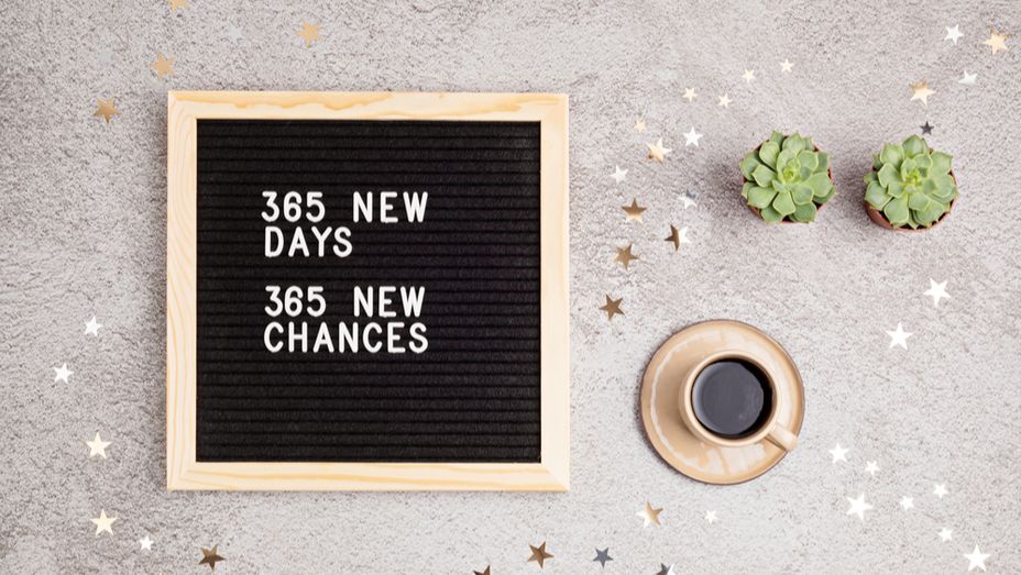 a letter board with the words 365 new days 365 new chances written on it .