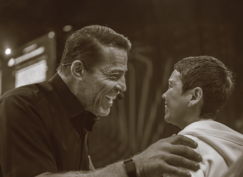 a man and a woman are smiling at each other