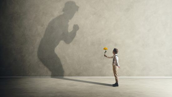 Man holding flower in gesture of forgiveness