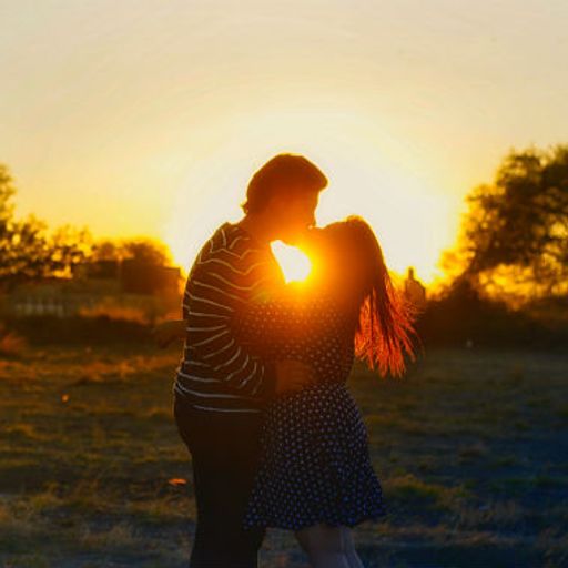 Couple kiss in Sunset