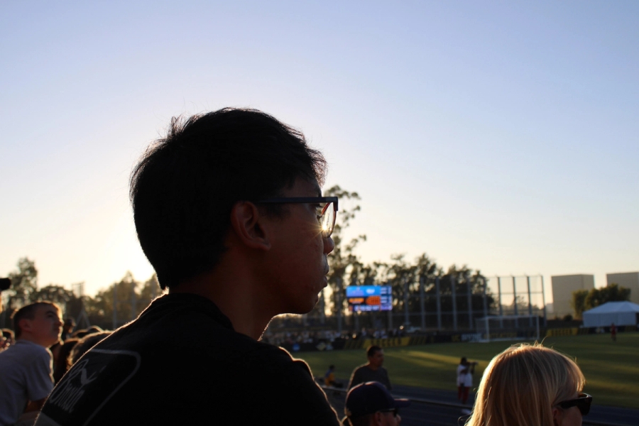 Boy staring at the field.