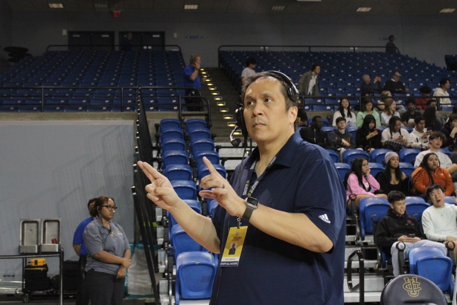 Band director conducting and staring at band.