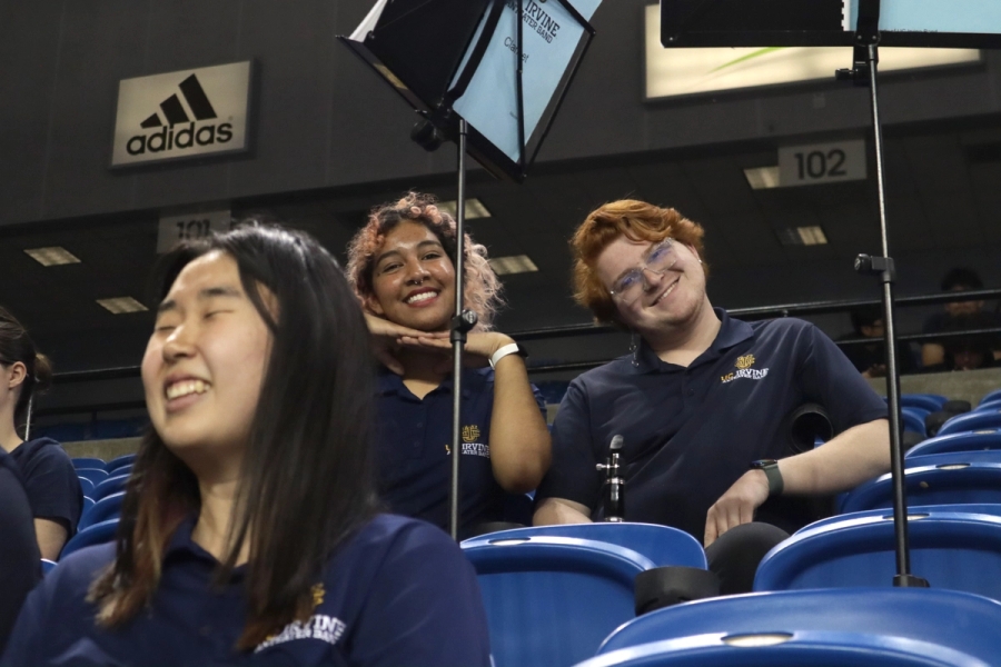 Girl and boy smiling at camera.