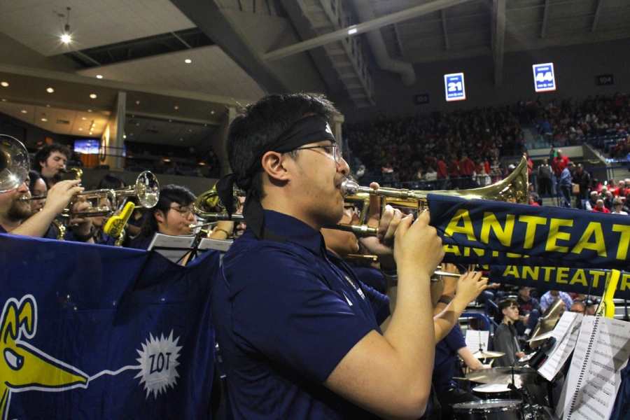Side POV of trombones playing.