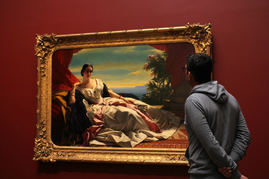 Man admiring painting.