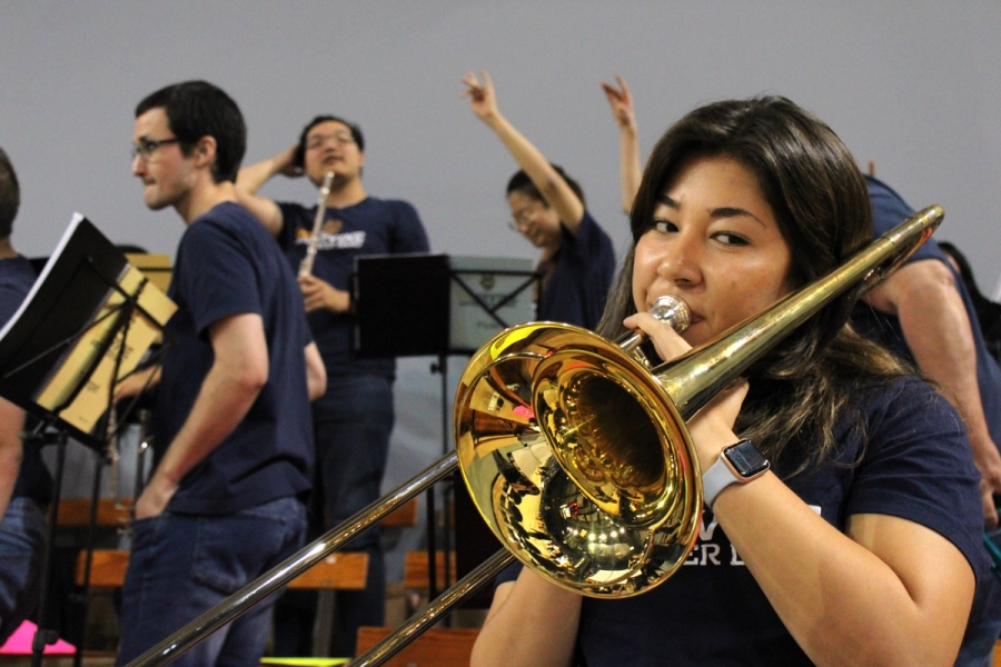 Front POV of girl playing trombone.