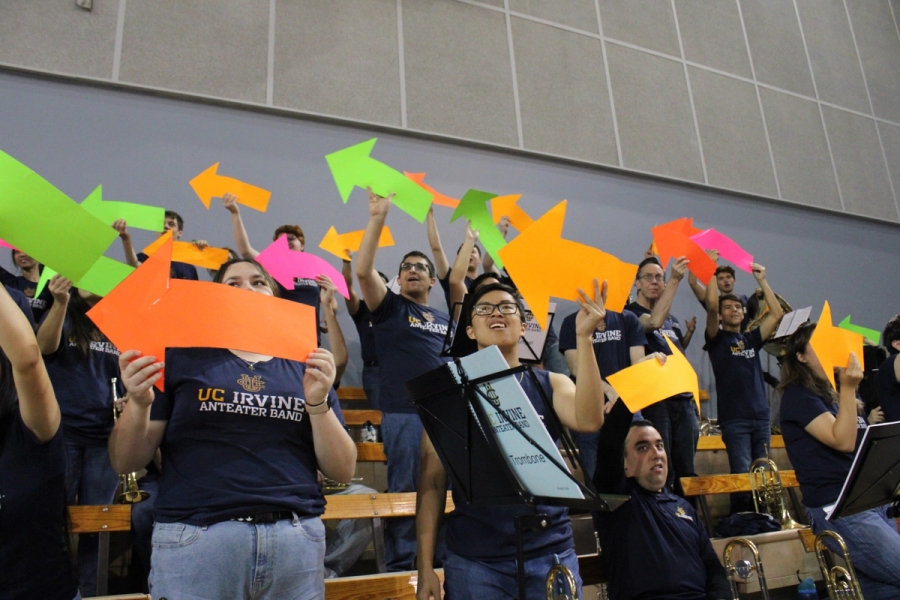 Band holding up colorful arrows.