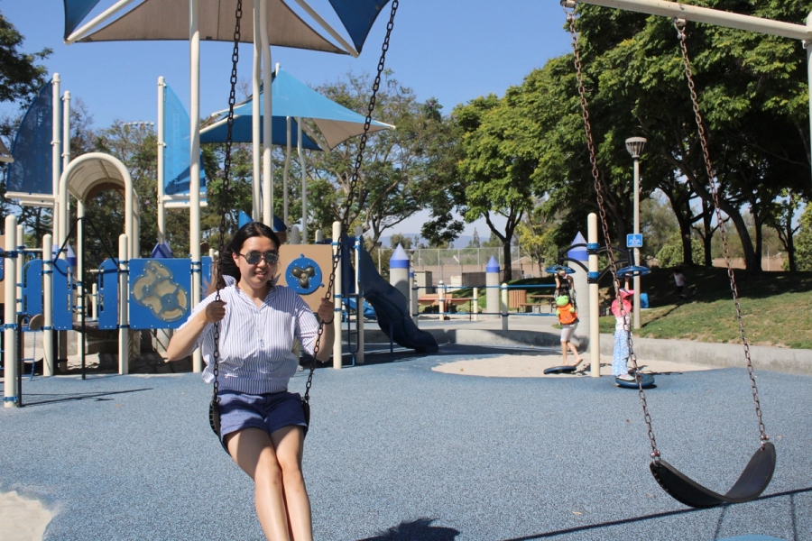 Girl about to swing.